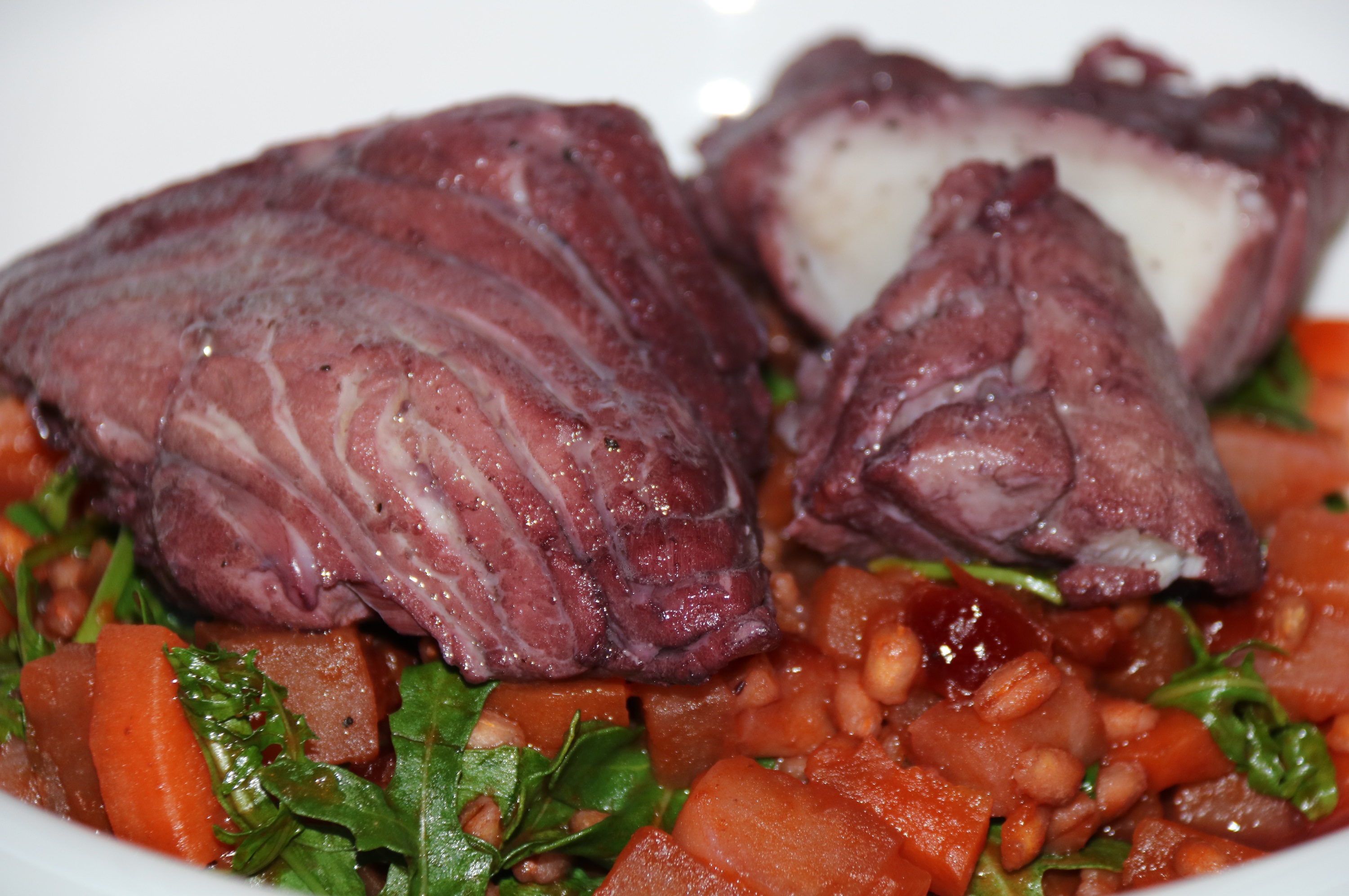 Coley poached in red wine with a spring spelt & barley stew